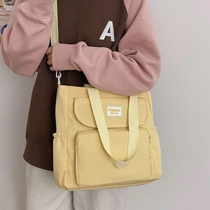 Fashionable yellow multi-pocket tote bag for students with stylish nylon straps