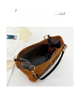 Detail view of large corduroy tote bag interior with zipper pocket and spacious storage