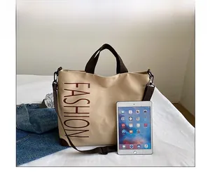 Canvas tote bag detail showing large size compared to an iPad on a white surface