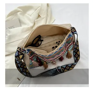 Interior view showing capacity for phones, folding umbrella and glasses in a tassel bag