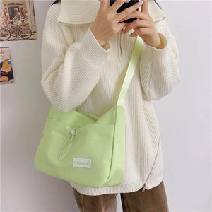 Minimalist light green messenger bag with fashion label and drawstring for women