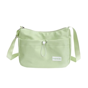 Minimalist light green nylon dumpling shoulder bag with white drawstring pocket and strap