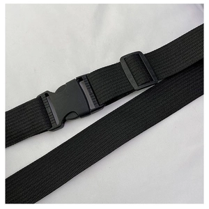Detail of adjustable black nylon shoulder strap with plastic buckle for crossbody chest bags
