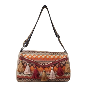 Ethnic bohemian shoulder bag with vibrant geometric patterns and colorful tassels