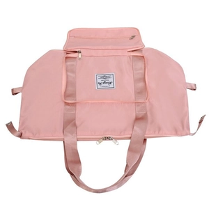 Pink large capacity waterproof travel bag with multiple pockets and durable handles