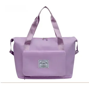 Front view of purple waterproof nylon travel tote bag with durable dual handles and zipper