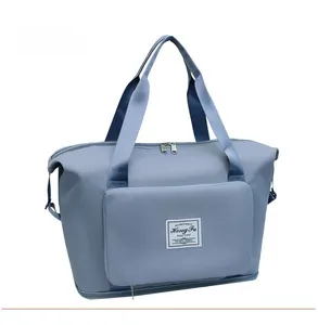 Micro-lateral view of grey blue large capacity travel bag with waterproof nylon fabric