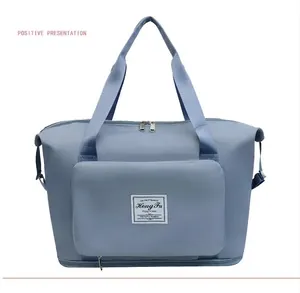 Light blue large capacity travel bag with waterproof fabric and wet-dry separation base