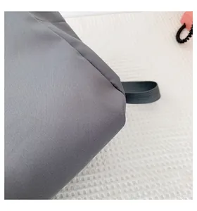 Detail shot of the durable grey nylon fabric texture on this sweet style backpack