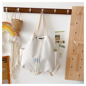 Minimalist beige nylon drawstring bucket bag with side pockets and fashion woven label