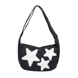 Black nylon crescent crossbody bag featuring three white plush star appliques and adjustable strap