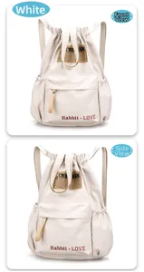 Vues détaillées avant et latérale du sac à dos en nylon blanc avec l'inscription Rabbit LOVE