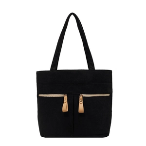 Minimalist black corduroy tote bag with double front zippers and wide shoulder straps