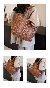 Detail of a brown quilted tote bag showing high-gloss fabric and diamond stitching