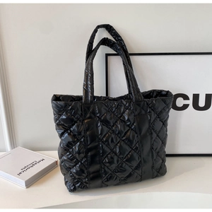 Minimalist black quilted tote bag with glossy finish and rhombus pattern for daily use