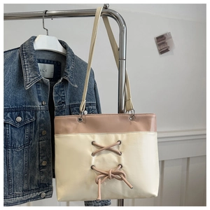 Minimalist beige and cream patchwork PU leather tote bag with stylish bow tie decoration