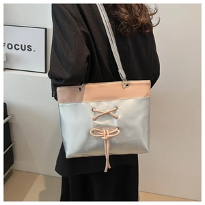 Fashion silver metallic tote bag with pink bow ribbon detail for women's daily commute