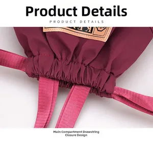 Détail du sac de voyage en nylon bordeaux montrant le tissu dense et la fermeture à cordon