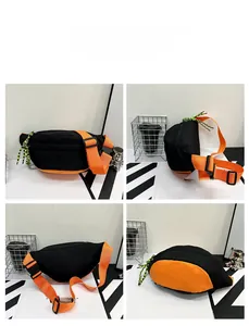 Detail view of contrast nylon chest bag with orange straps and woven zipper pulls