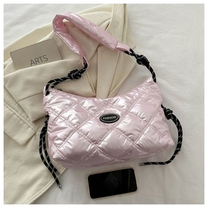 Close-up of pink quilted down bag with shiny metallic finish and woven rope detail