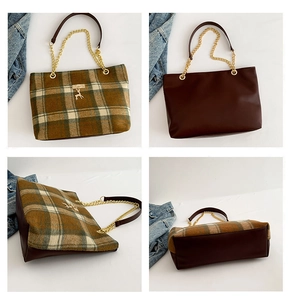 Close-up of vintage plaid tote bag with golden deer pendant and metal chain strap details