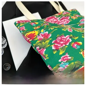Detail showing high-quality canvas texture and traditional green peony floral print