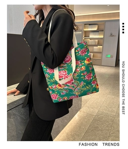Detail of floral canvas tote bag with traditional Chinese patterns on female model