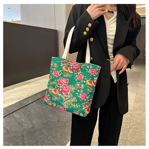 Close-up of high-capacity canvas tote bag with traditional Chinese floral patterns