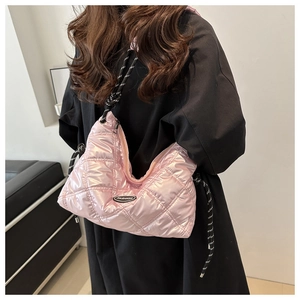 Pink quilted hobo shoulder bag with glossy metallic finish and woven strap
