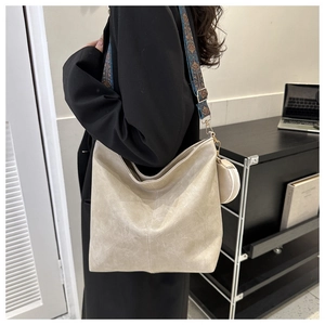 Chic cream-colored large capacity shoulder bag with a patterned ethnic wide strap