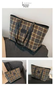 Detail view of large capacity brown plaid tote bag with FrancescA leather patch