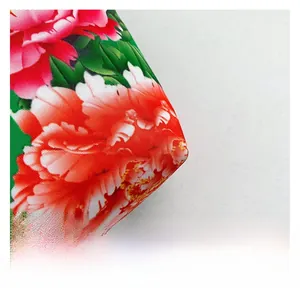 Macro shot of ethnic nylon bag fabric showing vibrant peony floral print and weaving texture