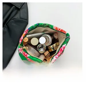 Spacious ethnic nylon pouch for cosmetics with floral print and zipper closure