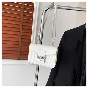 Minimalist white square crossbody bag with quilted pattern and silver buckle on hanger