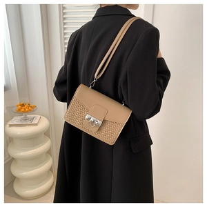 Chic khaki crossbody square bag with woven texture and silver metal buckle on strap