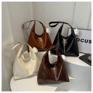 Minimalist vintage tote bag in various colors with plush rabbit pendant and wide strap