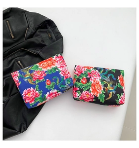 Detailed view of floral nylon pouches with traditional Chinese peony and phoenix patterns