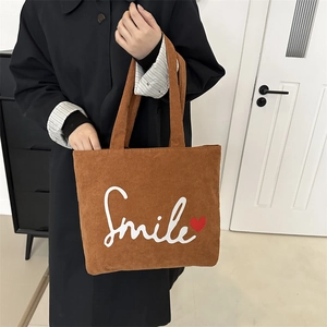 Brown corduroy tote bag with Smile text and red heart pattern for casual daily use