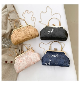 Detail of four vintage floral embossed evening bags with metal kiss lock and gold handles