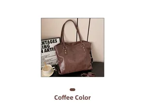 Detail view of the coffee brown tote bag with metal rings and reinforced rivets