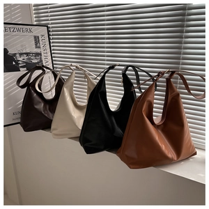 Four minimalist large capacity tote bags in dark coffee, beige, black, and caramel brown