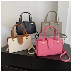 Detailed close-up showing four color variants of solid texture satchel bags on stands