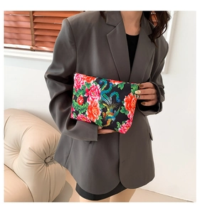 Ethnic nylon clutch bag featuring vibrant red peony and phoenix embroidery patterns