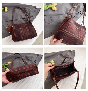 Detail view of plaid tote bag featuring golden flower ornament and spacious interior