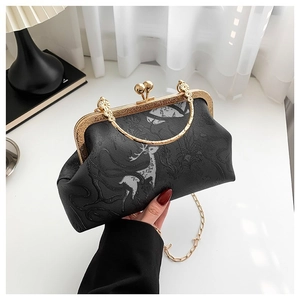 Chic black vintage frame bag with embossed deer pattern and elegant gold chain strap