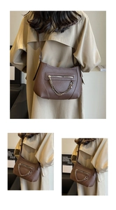 Detail of dark brown lychee leather tote with gold chain and front zipper pocket