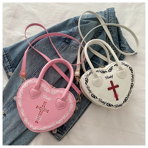Detail of heart-shaped PU leather bag with Baby text print and removable strap