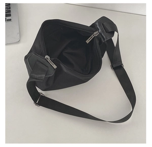 Top view of large black minimalist tote bag showing spacious interior and silver zippers