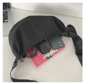 Top view of spacious black crescent moon bag showing ample storage for daily essentials