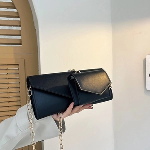 Chic black PU leather two-in-one crossbody bag featuring gold chain and envelope flap